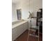 Hallway area with cabinets, decorations, ladder, and miscellaneous items at 9940 Trailing Vine St, Las Vegas, NV 89183