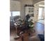 Bright living room featuring hardwood floors, neutral walls, and plenty of natural light, perfect for a cozy atmosphere at 9940 Trailing Vine St, Las Vegas, NV 89183