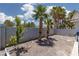 Expansive backyard featuring palm trees, gravel landscaping, and ample space for recreation at 998 Hunters Run Dr, Henderson, NV 89002