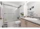 Clean bathroom features a shower-tub combo, granite countertop, and ample storage space for toiletries at 998 Hunters Run Dr, Henderson, NV 89002
