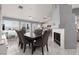 Open dining area with natural light, a fireplace, and seamless flow to the kitchen, perfect for gatherings at 998 Hunters Run Dr, Henderson, NV 89002