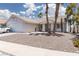Charming single-story home with desert landscaping, tiled roof, and a two-car garage at 998 Hunters Run Dr, Henderson, NV 89002