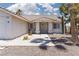 Inviting front entry with desert landscaping and a tiled roof, offering curb appeal at 998 Hunters Run Dr, Henderson, NV 89002