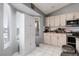 Bright kitchen with ample natural light, updated appliances, and crisp white cabinetry for a clean, modern feel at 998 Hunters Run Dr, Henderson, NV 89002