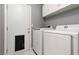 Practical laundry room equipped with modern washer and dryer, offering convenience and efficiency at 998 Hunters Run Dr, Henderson, NV 89002