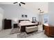 Spacious primary bedroom with a ceiling fan, a comfortable bed, and stylish furniture for a serene retreat at 998 Hunters Run Dr, Henderson, NV 89002