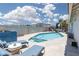 Inviting pool and patio area featuring mountain views and comfortable seating at 998 Hunters Run Dr, Henderson, NV 89002
