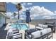 Relaxing pool area featuring comfortable seating and a grill for outdoor enjoyment at 998 Hunters Run Dr, Henderson, NV 89002