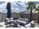 Outdoor patio area with seating, grill and refreshing pool with mountain views at 998 Hunters Run Dr, Henderson, NV 89002