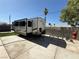 Spacious backyard with a RV trailer, exercise equipment and concrete patio at , Las Vegas, NV 89104