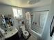 Well-lit bathroom with modern vanity, toilet, and shower-tub combination at , Las Vegas, NV 89104