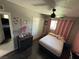 Comfortable bedroom features wood floor, modern ceiling fan, and ample natural light at , Las Vegas, NV 89104