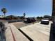 Driveway showing multiple parked vehicles and a partial view of neighboring houses at , Las Vegas, NV 89104