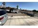 Front yard featuring a desert landscape, a driveway, and a large parked truck at , Las Vegas, NV 89104
