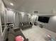 Bright living room with white tile floors, modern lighting, and comfortable seating at , Las Vegas, NV 89104