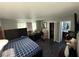 Spacious main bedroom features wood floors, fan, closet and attached bathroom at , Las Vegas, NV 89104