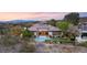 Stunning aerial view of the backyard featuring a sparkling pool and mountain views at 1 Dry Brook Trl, Henderson, NV 89052