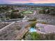 Overhead view showcases community, nearby golf course, and house with a private backyard pool at 1 Dry Brook Trl, Henderson, NV 89052
