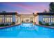Serene backyard featuring a long sparkling pool, well-manicured lawn, and inviting patio area at 1 Dry Brook Trl, Henderson, NV 89052