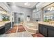 Luxurious bathroom with double vanities, a soaking tub, and a separate glass block shower at 1 Dry Brook Trl, Henderson, NV 89052