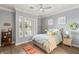 Bright bedroom features a ceiling fan, neutral walls and comfortable furnishings at 1 Dry Brook Trl, Henderson, NV 89052