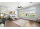 Bright and airy bedroom with large windows, plantation shutters, and a view of the outdoors at 1 Dry Brook Trl, Henderson, NV 89052