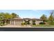 Stunning single-story home with mature landscaping and a three-car garage, showcasing elegant design at 1 Dry Brook Trl, Henderson, NV 89052