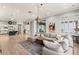 Expansive living space featuring hardwood floors, fireplace, and abundant natural light at 1 Dry Brook Trl, Henderson, NV 89052
