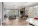 Bright living room with hardwood floors, fireplace, and light-filled windows at 1 Dry Brook Trl, Henderson, NV 89052