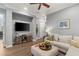 Comfortable living room features a large TV, plush sofa, and stylish decor at 1 Dry Brook Trl, Henderson, NV 89052