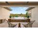 Inviting pool area with desert views, string lights, and comfortable seating at 1 Dry Brook Trl, Henderson, NV 89052