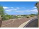 Backyard featuring desert landscaping and a view of the golf course and mountains at 10700 Button Willow Dr, Las Vegas, NV 89134