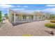 Well-maintained backyard with a covered patio, desert landscaping, and a charming exterior at 10700 Button Willow Dr, Las Vegas, NV 89134