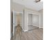 Neutral bedroom featuring mirrored closet doors and a window at 10700 Button Willow Dr, Las Vegas, NV 89134