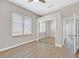 Bedroom featuring a window, closet, base trim, ceiling fan, and hard surface floors at 10700 Button Willow Dr, Las Vegas, NV 89134