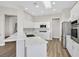 Modern kitchen with white cabinets, stainless steel appliances, and a spacious quartz countertop at 10700 Button Willow Dr, Las Vegas, NV 89134
