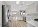 Modern kitchen features stainless steel appliances, ample cabinets, and stylish quartz countertops at 10700 Button Willow Dr, Las Vegas, NV 89134