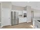 Well-lit kitchen showcasing stainless steel appliances and white cabinets at 10700 Button Willow Dr, Las Vegas, NV 89134