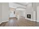 An open-concept living area with a fireplace, hard flooring, and abundant natural light at 10700 Button Willow Dr, Las Vegas, NV 89134