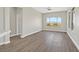 Spacious living room with scenic views, ceiling fan, and luxury vinyl flooring at 10700 Button Willow Dr, Las Vegas, NV 89134