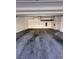 Clean two-car garage with storage racks and painted floors at 12112 Polar White Ct # 3, Las Vegas, NV 89183