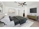 A spacious bedroom features a ceiling fan, ensuite bath, and a king-sized bed at 12112 Polar White Ct # 3, Las Vegas, NV 89183