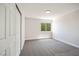 Comfortable carpeted bedroom with a closet and window providing ample natural light at 1312 Pacific Terrace Dr, Las Vegas, NV 89128