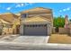 Exterior of home with two car garage at 1312 Pacific Terrace Dr, Las Vegas, NV 89128