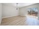 Bright living space featuring wood-look floors, a sliding door and backyard access at 1312 Pacific Terrace Dr, Las Vegas, NV 89128