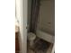 Cozy bathroom shows a toilet and bathtub with a neutral shower curtain at 1515 E Reno Ave # D202, Las Vegas, NV 89119