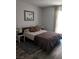 Cozy bedroom features a comfortable bed with a patterned duvet and decorative pillows at 1515 E Reno Ave # D202, Las Vegas, NV 89119