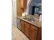 Kitchen with stainless steel dishwasher, double sink, and light wood cabinets at 1515 E Reno Ave # D202, Las Vegas, NV 89119