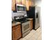Kitchen features stainless steel appliances including microwave, oven, and refrigerator at 1515 E Reno Ave # D202, Las Vegas, NV 89119
