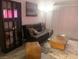 Relaxing living room space featuring a futon, and storage at 1515 E Reno Ave # D202, Las Vegas, NV 89119